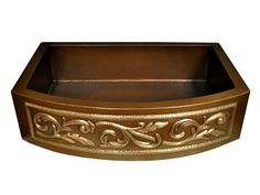 an ornately designed copper sink on a white background