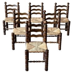 six wooden chairs with woven seats