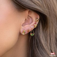 "I am Iron Man." Channel your inner Tony Stark and take your style to new heights with our Marvel's Iron Man Studs. Each stud showcases a fiery red stone encased within sleek metalwork, artfully outlining the iconic helmet of the invincible Avenger. Marvel Earrings, The Infinity Stones, Sorcerer Supreme, Eye Of Agamotto, Marvel Jewelry, Mystic Arts, Marvel Fashion, Infinity Stones, Infinity Gauntlet