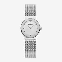 Classic, puristic, and yet exciting. Perfect style combined with contemporary minimalism. Inspired by Danish design, the CLASSIC COLLECTION represents a unique timepiece, perfectly highlighting your daily style.The polished silver colored stainless steel case, made of pure, high quality, medical-grade stainless steel (316L), in combination with the modern silver colored milanese strap, provides the classic BERING look. The fine workmanship of the milanese strap gives the watch a refined, almost Minimalist White Everyday Watch, White Minimalist Everyday Watch, Modern Everyday Watches With Metal Dial, Minimalist Silver Watch With Subdials, Minimalist Silver Analog Watch, Minimalist Silver Watch Accessories For Everyday, Modern Analog Watches For Everyday Wear, Minimalist Analog Watch As Gift, Modern Watches With Bracelet Strap