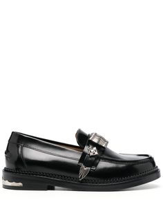 black calf leather smooth grain glossy finish silver-tone hardware decorative buckle detail tonal stitching round toe slip-on style branded leather insole leather stacked sole Calf Leather Slip-on Loafers With Buckle Closure, Luxury Slip-on Loafers With Buckle Closure, Luxury Black Loafers With Buckle Closure, Luxury Slip-on Loafers With Tang Buckle, Classic Patent Leather Loafers With Buckle Closure, Patent Leather Slip-on Loafers With Buckle, Designer Calf Leather Loafers With Buckle Closure, Patent Leather Buckle Closure Slip-on Loafers, Slip-on Patent Leather Loafers With Buckle Closure