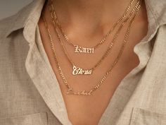 This 14k solid gold name necklace is made from a dainty, yet chic flat figaro chain. Its beautiful finish shines against your skin to accentuate your beauty. Don't forget to choose the best length that works for you! FEATURES • Material: 14k Solid Gold (Stamped 14K for authenticity) • Color Options: Yellow Gold • Chain Style: Flat Figaro Chain • Chain Width: 3.00 mm • Clasp Type: Lobster Clasp • Available Lengths: 14", 15", 16", 17", 18", 19", 20" For custom lengths feel free to contact us. We c Elegant Custom Nameplate Chain Necklace, Elegant Name Pendant Chain Necklace, Elegant Pendant Chain Necklace With Name, Elegant Personalized Yellow Gold Chain Necklace, Elegant Custom Name Chain Necklace, Figaro Chain Nameplate Jewelry For Anniversary, Anniversary Silver Name Necklace With Figaro Chain, Elegant Gold Chain Necklace With Custom Name, Personalized White Gold Elegant Chain Necklace