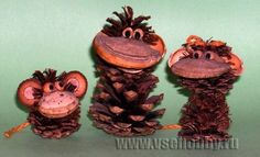 three stuffed animals made out of pine cones