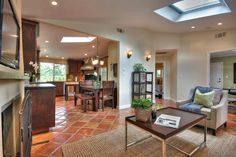 a living room filled with furniture and a fire place