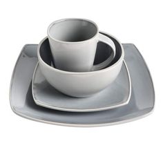 a set of three white dishes with grey rims on top of each other,