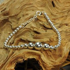 Ball Bracelet 925 Sterling Silver Minimalist Bead * Product Type: Pendants * Material: 100% 925 Sterling Silver * Marked: Stamped 925 * Adjustable length: 17.5 cm - 19.5 cm / 6.88 in - 7.67 in * Diameter ball:10 mm / 0.39 in * Closure: Spring Ring * Weight: Approximately 10 grams * Additional Finish: Hand Polishing * Density: Solid * Item Conditions: New Fact New from the BELDIAMO ESSENCE Collection introduced the beaded silver bracelet. A simple but elegant design, crafted from BELDIAMO Sterlin Classic Sterling Silver Bracelets With Spacer Beads, Sterling Silver Round Beads Minimalist Bracelet, Minimalist Sterling Silver Bracelets With Spacer Beads, Minimalist Sterling Silver Bracelet With Beads, Sterling Silver Bracelet With Round Silver Beads, Classic Sterling Silver Bracelets With Silver Beads, Classic Sterling Silver Bracelet With Beads, Elegant Sterling Silver Bracelet With Polished Beads, Sterling Silver Bracelet With 8mm Beads