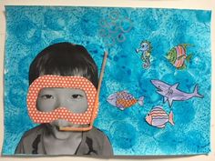 a child's face with a mask and fish on it, in front of a blue background