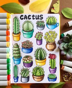 an open notebook with cactus stickers on it next to markers and crayons