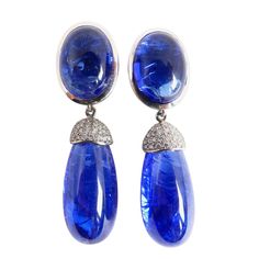 Thomas Leyser is renowned for his contemporary jewellery designs utilizing fine coloured gemstones and diamonds. These pair of earrings in 18K white gold (13.38g) are set with 2x fine Tanzanite Cabouchons (oval, 16x12mm, 21.76ct). + 2x Tanzanite Briolets (28.5x13.2mm, 53.53ct) + 56x Diamonds (brillant-cut, 1mm, G/VS, 0.56ct). Currently clips at the back which can be replaces by studs. Rose Gold Drop Earrings, Diamond Choker Necklace, Multicolor Jewelry, Contemporary Jewelry Design, Tanzanite Jewelry, Geode Earrings, Diy Jewelry Necklace, Blue Beauty, Rene Lalique