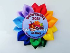 a rainbow colored ribbon with the words pennsylvania on it and an orange, yellow, green, blue, and red bow