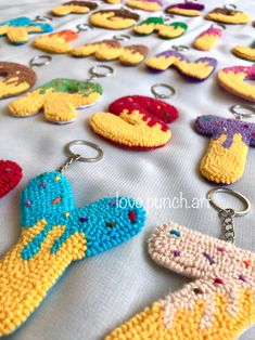 crocheted keychains are displayed on a table