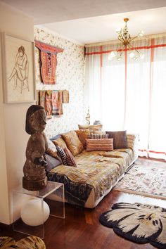 a living room filled with furniture and rugs