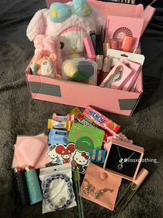 a pink box filled with lots of items