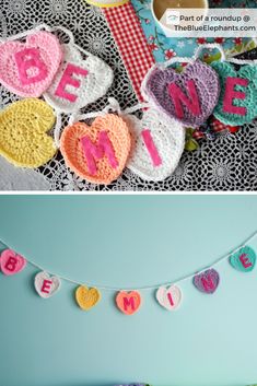 crocheted letters are hanging on the wall next to a bed with pillows and blankets