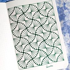 a notebook with an intricate design on it