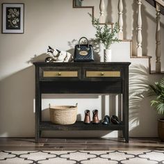 an entryway with shoes and purses on the shelf next to it, along with stairs