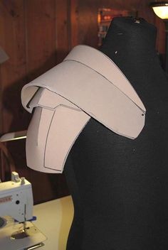 a mannequin's head with a piece of paper taped to the side