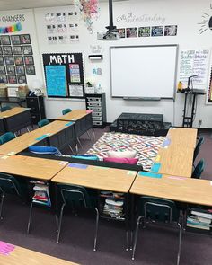 an empty classroom with desks and chairs