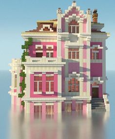 a pink and white building with lots of windows on top of it's roof