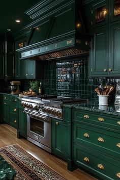 a kitchen with green cabinets and an oven