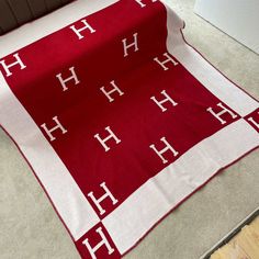 a red and white blanket on the floor