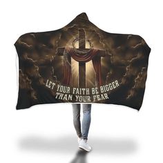 a hooded blanket with the words let your faith be bigger than your fear