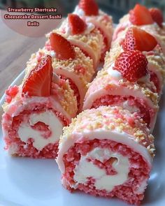 strawberry shortcake with cream filling and strawberries in the middle on a white plate