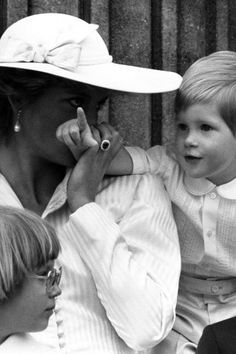 a woman and two children sitting next to each other