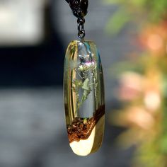 "Dandelion necklace for women. Dandelion in resin pendant necklace. Wood resin jewelry handmade. Epoxy wood art. Unique gifts for her ♥ This item is handmade, so each piece is unique. The piece you receive will be based on this design and very similar to photos. ♥♥ Please see the current discounts in the shop announcement: https://www.etsy.com/shop/TSMDecorations Handmade from natural wood and clear art resin. Small Thai dandelion was sealed in resin. This necklace pendant will undoubtedly draw Dandelion Necklace, Resin Pendant Necklace, Wood Resin Jewelry, Wood Resin, Unique Gifts For Her, Resin Pendant, Make A Wish, Resin Jewelry, Wood Art