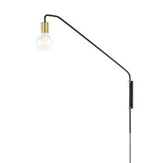 a black and gold floor lamp with a white light bulb on the top of it