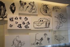 some drawings are hanging up on the wall