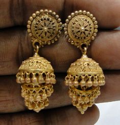 vintage 22 K solid gold chandelier dangle earrings. Fully handmade pair in very good condition. Length-1.5 inches. Weight-13 grams, material-22 K solid gold (marked). Antique Gold Earrings For Festivals, Antique Gold Earrings With Latkans, Ceremonial Heavy Gold Danglers, Ornate Jhumkas Drop Earrings With Latkans, Heavy Gold Brass Chandbalis, Ornate Jhumkas With Latkans Drop Earrings, Gold Brass Chandbalis With Latkans, Gold Chandbalis With Latkans In Brass, Traditional Gold Brass Danglers