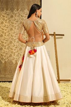 Ivory lehenga with placement hand embroidery using gota patti, dabka and zardozi. Paired with a blouse with all over hand embroidery in basra motifs and dupatta with all over flower vine, gota patti embroidery. - Aza Fashions White Raw Silk Dress With Cutdana, Off White Traditional Wear For Reception And Navratri, Off White Lehenga With Pallu For Reception, Cream Choli For Diwali Reception, Off White Festive Choli For Reception, Festive Off White Choli For Reception, Festive Off-white Choli For Reception, Off-white Festive Choli For Reception, Cream Choli For Navratri Reception