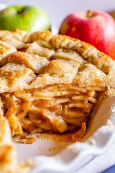 an apple pie is cut in half on a plate