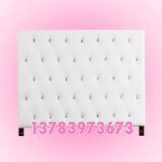 a white headboard with buttons on it and the words 788973873