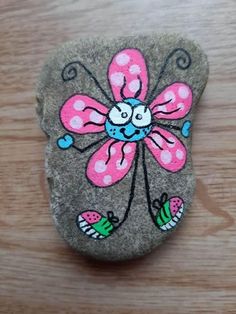 a rock with a flower painted on it