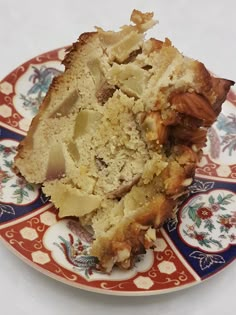 a piece of cake sitting on top of a red and white plate