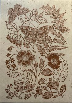 a brown and white drawing of flowers on a piece of paper that has been printed onto it