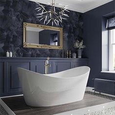 a bathtub sitting in front of a window next to a radiator and a mirror