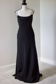 Elevate your style with this chic vintage Y2K black maxi dress, featuring a sophisticated cowl neckline. Perfect for evening events and special occasions, this dress exudes timeless elegance and effortless grace. Embrace the classic fashion of the early 2000s with this versatile and stylish piece. Add this stunning vintage dress to your collection for a touch of retro charm and modern sophistication. Fits a size medium.  Message for measurements. Black Maxi Dress With Cowl Back For Evening, Chic Black Maxi Dress With Cowl Back, Fitted Black Maxi Dress With Cowl Back, Classic Fitted Evening Maxi Dress, Black Formal Dress With Cowl Back, Formal Black Dress With Cowl Back, Fitted Silk Maxi Dress With Cowl Neck, Fitted Evening Dress With Cowl Back For Formal Events, Fitted Evening Dress With Cowl Back For Formal Occasions