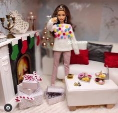 a barbie doll is standing in front of a christmas tree with presents on the floor