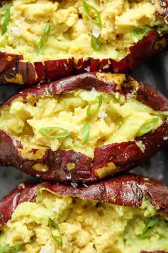 baked potatoes with avocado and herbs on top