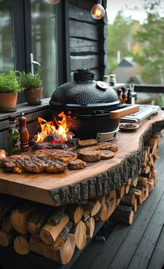 an outdoor bbq grill is set up on a wooden table with firewood and potted plants