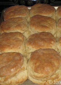 a pan filled with rolls sitting on top of a stove