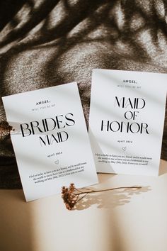 two paper flyers sitting on top of a bed next to each other with the words brides maid written on them