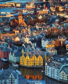 an aerial view of some buildings and water