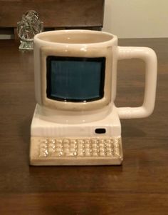 a coffee mug shaped like an old computer