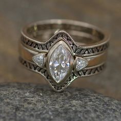 a close up of a ring on a rock