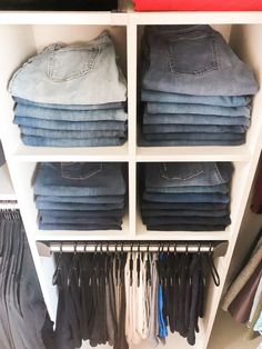 a closet filled with lots of different colored jeans