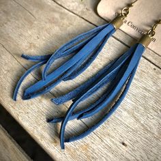 "-These tassel earrings are made from soft cadet-blue deerskin leather. Part Western, part Boho, part Rock 'n Roll, these little fringe earrings give a big kick to any outfit. -Lightweight enough to wear every day. -3\" - 3.5\" total length, including earwires. -Earwires are antique-brass. -Deerskin leather is sustainably sourced in the USA. -Ok to get wet. -Available in 10 colors. -Designed and handmade in South Pasadena, CA. Check out more of our awesome earrings here: https://www.etsy.com/sho Blue Fringe Tassel Drop Earrings, Blue Dangle Tassel Earrings With Fringe, Blue Fringe Drop Earrings, Blue Fringe Earrings As Gift, Blue Fringe Earrings For Gift, Blue Dangle Tassel Earrings As Gift, Blue Dangle Tassel Earrings For Gift, Dangly Earring, Awesome Earrings